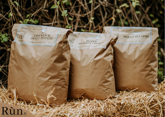 Rùn Cold Pressed dog food on hay bale